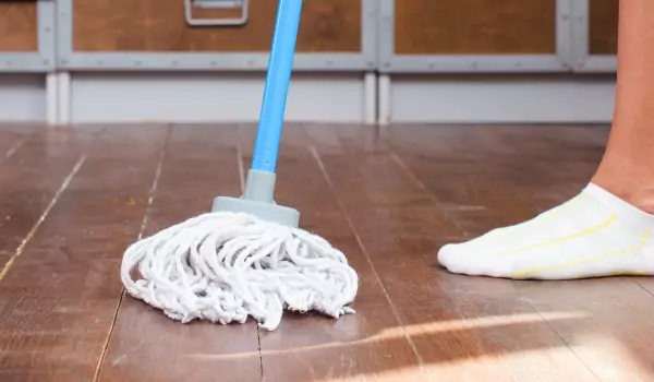 cropped picutre of a person cleaning the floor