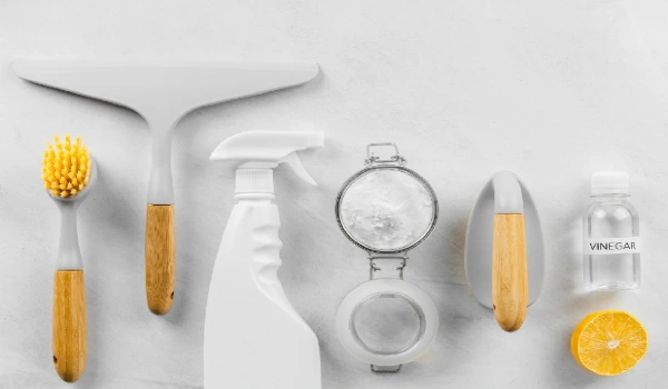 Top view of eco cleaning products with lemon and baking soda