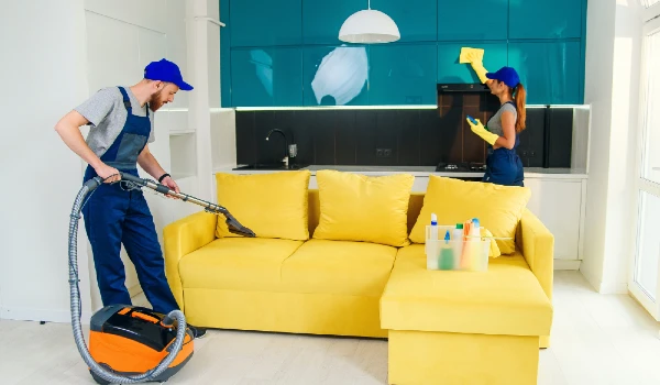 Young man and woman cleaning living room