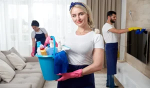 Professional cleaning service team cleans living room in modern apartment