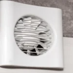 The fan is built into the wall in the bathroom toilet or kitchen