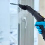 Winter window cleaning performed with a squeegee for optimal results and clarity