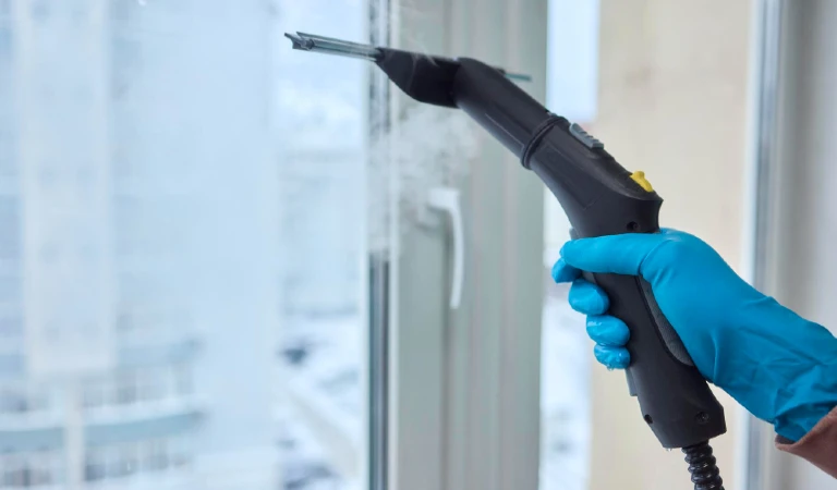 Winter window cleaning performed with a squeegee for optimal results and clarity