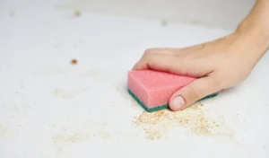 Close-up of woman hand holding paper on table